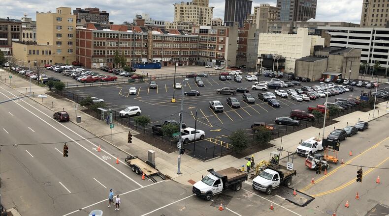 The owner of Club Masque, which closed in January, has sued the city of Dayton, CityWide and CareSource over a dispute about the parking lot at East Second and North St. Clair streets. CORNELIUS FROLIK / STAFF