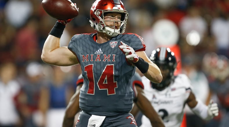 OXFORD, OH - SEPTEMBER 16: Gus Ragland #14 of the Miami Ohio Redhawks throws a pass during the first half against the Cincinnati Bearcats at Yager Stadium on September 16, 2017 in Oxford, Ohio. (Photo by Michael Reaves/Getty Images)