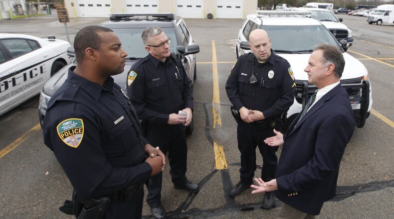 David A. Finnie, right, Wright State University police chief, said the first job at an active violence scene is to stop the threat. Finnie called in more officers Monday as a precaution after an attack at Ohio State University. CHRIS STEWART / STAFF