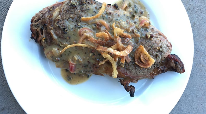 Grilled rib-eye steak with onion straws. (Lee Svitak Dean/Minneapolis Star Tribune/TNS)