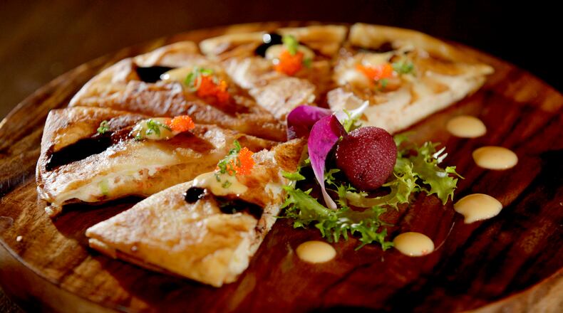 Blue Crab Fajita, a Japanese appetizer on the Ozu 852 menu, is made with blue crab, red onion and cream cheese in a fajita wrap topped with balsamic spicy mayo sauce and garnished with yamamomo fruit. Ozu 852 has won the Best Asian Food category in the Best of Dayton contest for numerous years. The restaurant, located at 852 Union Blvd. in Englewood, is known for fresh, quality sushi, hibachi, Chinese and Japanese foods. LISA POWELL / STAFF