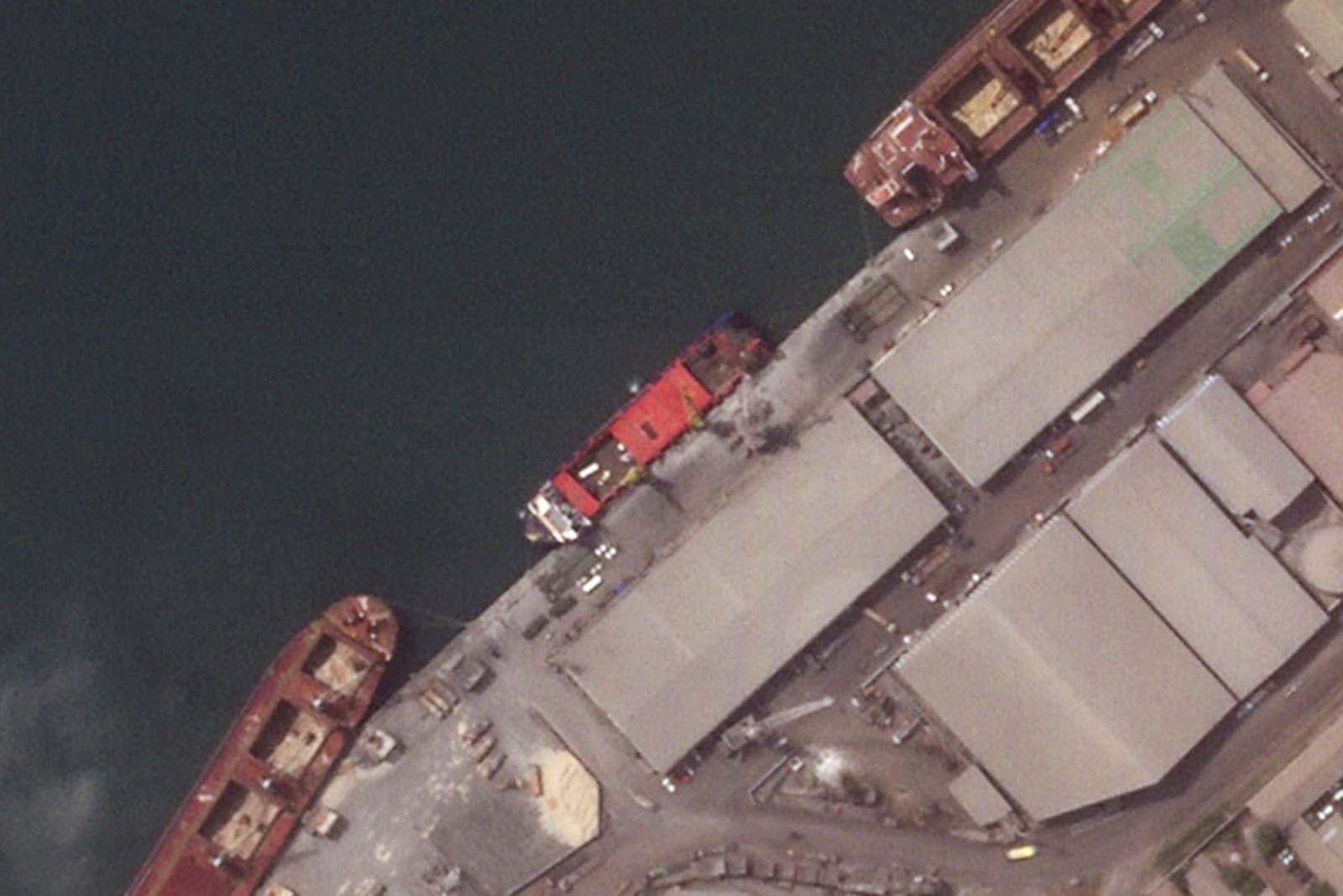 This satellite image provided by Planet Labs PBC shows the Russian flagged cargo ship, Patria, unloading military vehicles, May, 27, 2024, in Conakry, Guinea. (Planet Labs PBC via AP)