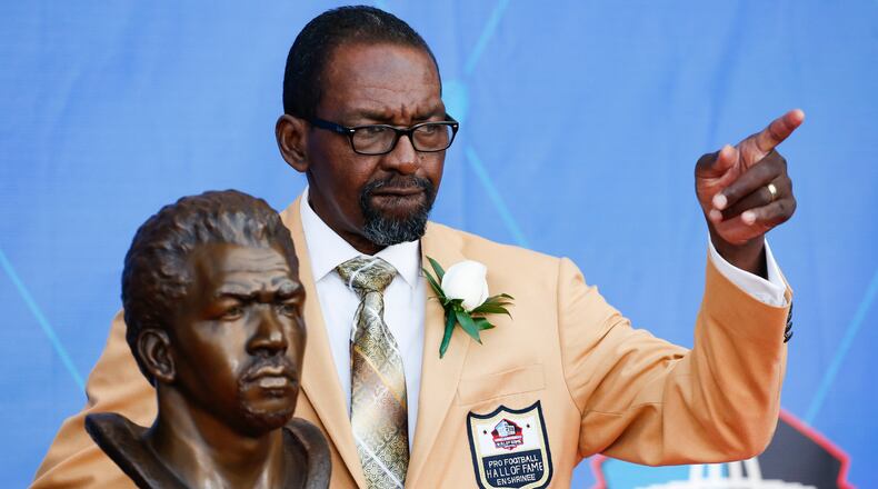 FILE - Former NFL player Kenny Easley poses with a bust of himself during an induction ceremony at the Pro Football Hall of Fame, Saturday, Aug. 5, 2017, in Canton, Ohio. (AP Photo/Ron Schwane, File)
