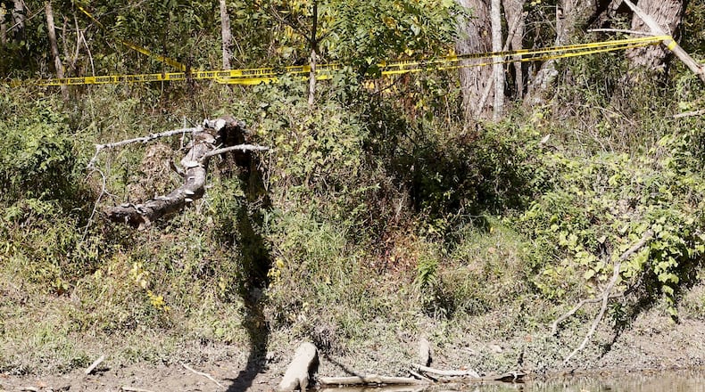 Warren County Sheriff’s security tape is strung through a heavily wooded area along the Little Miami River where a small airplane crash claimed the lives of a pilot and passenger in 2016. The family of the deceased passenger is seeking to get Aerial Markers placed by ziplines to improve pilot safety. Warren County Sheriff’s security tape is strung through a heavily wooded area along the Little Miami River where a small airplane crash claimed the lives of a pilot and passenger on Sunday, October 17, 2016. The crash scene is located about one-half mile south of State Route 350 where it crosses the scenic river. TY GREENLEES / STAFF