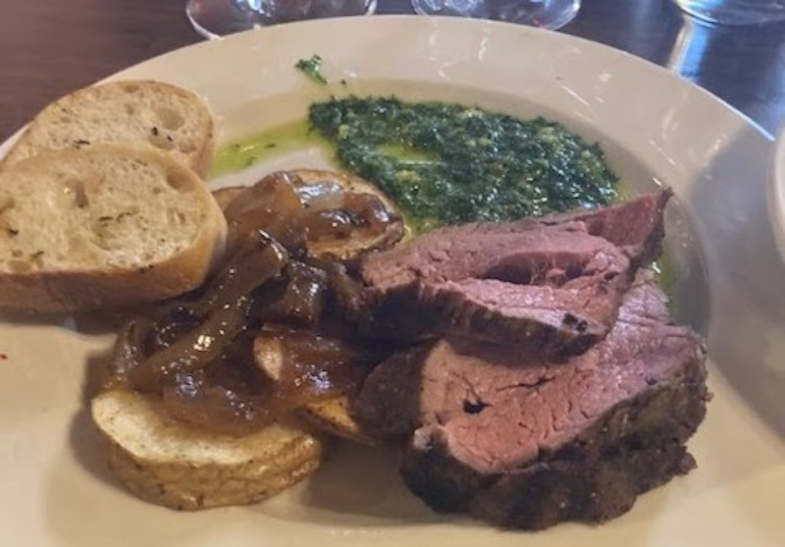 The Surf and Turf with sliced angus beef served with chimichurri at Jay's Seafood Restaurant in Dayton. RAY MARCANO/CONTRIBUTED