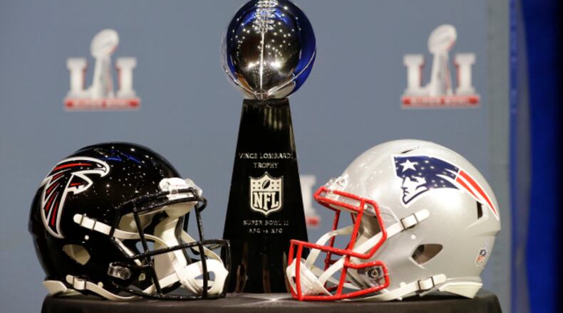 The Vince Lombardi Trophy is seen before NFL Commissioner Roger Goodell's news conference during preparations for the NFL Super Bowl 51 football game Wednesday, Feb. 1, 2017, in Houston. (AP Photo/David J. Phillip)