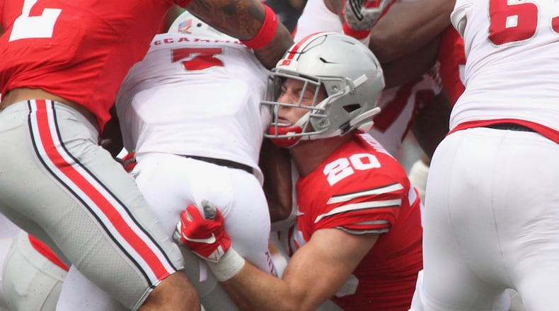 Ohio State’s Pete Werner makes a tackle against Florida Atlantic on Saturday, Aug. 31, 2019, at Ohio Stadium in Columbus. David Jablonski/Staff
