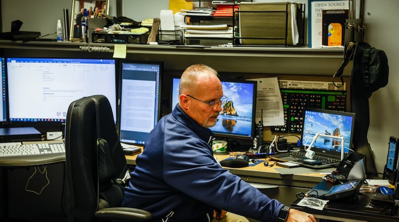 West Carrollton police detective, Robert Bell at his work station at the West Carrollton Police Department. Bell is the regional expert concerning electronic devises. JIM NOELKER/STAFF