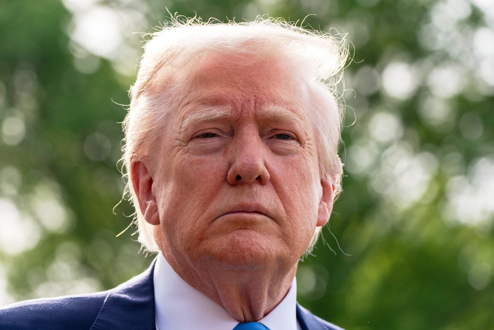 President Donald Trump speaks with reporters as he and first lady Melania Trump depart on Marine One from the South Lawn of the White House, Friday, April 25, 2025, in Washington. The President and first lady will be traveling to Rome and the Vatican to attend the funeral for Pope Francis. (AP Photo/Alex Brandon)