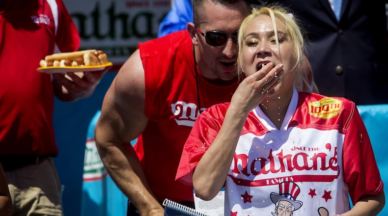 Women’s winner Miki Sudo competes in the annual Hot Dog Eating Contest at Coney Island July 4, 2016 in New York City. Joey Chestnut re-took the crown, eating 70 hot dogs and beating last year’s winner Matt Stonie’s 53 hot dogs consumed. (Photo by Eric Thayer/Getty Images)