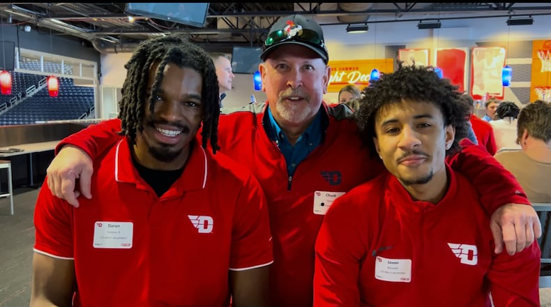 Doran's company and Lee's Famous Recipe are sponsors of the UD men's basketball team. L-R Daron Holmes II, Doran and current UD player Javon Bennett taken at the Connor Flight Deck last year.