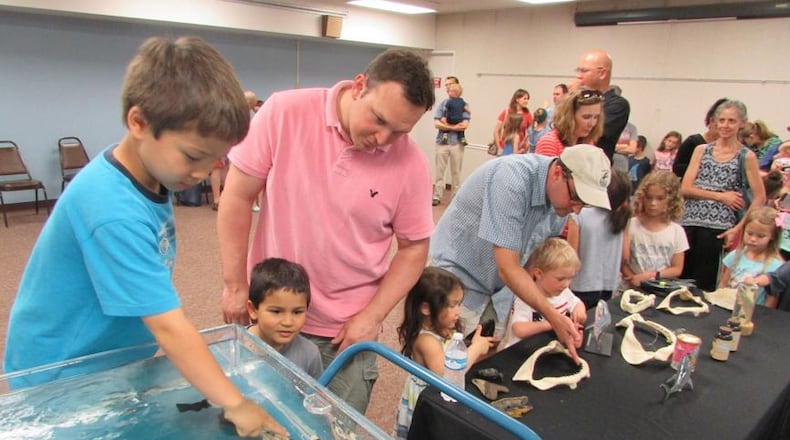 The Wright Memorial Public Library in Oakwood will celebrate the $500,000 Jack W. and Sally D. Eichelberger Historic Restoration at a Community Open House and Read-a-thon on the Lawn from 11 a.m.-2 p.m. Saturday, Aug. 11. Pictured are families participating in the library’s 2016 Summer Reading Program.