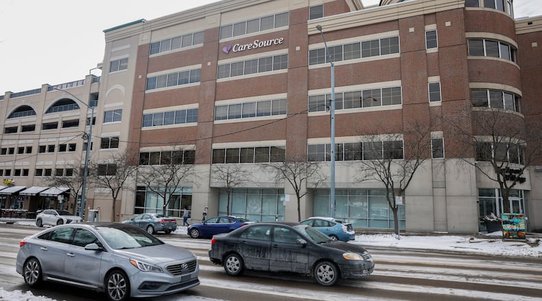 Vehicles drive past CareSource on Monday, Dec. 15, 2025, in downtown Dayton. CareSource Management Services LLC expects to create 167 full-time-equivalent positions, generating more than $12.5 million in new annual payroll as a result of the company’s expansion in Dayton, according to the Ohio Department of Development. JOSEPH COOKE/STAFF