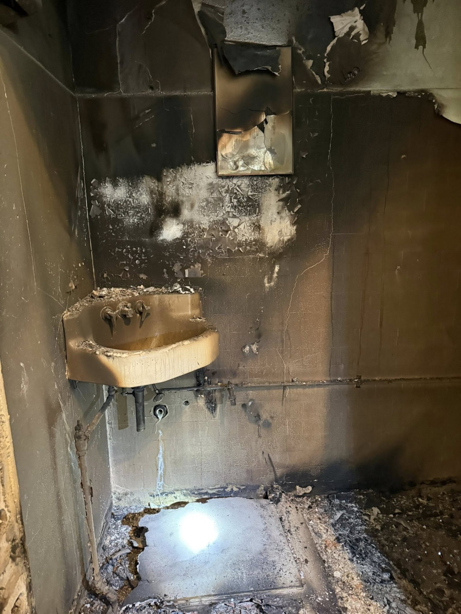 A fire started in a parking garage adjacent to Rabbit Hole Books on Feb. 12 caused the store to close due to smoke damage. CONTRIBUTED