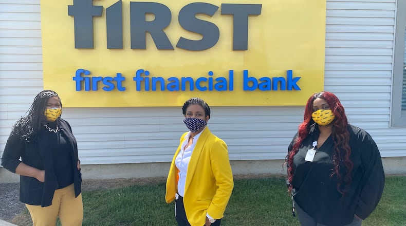 Employees outside the new First Financial Bank location in North Dayton