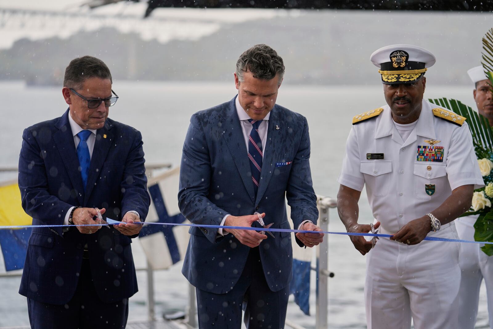 U.S. Defense Secretary Pete Hegseth, center, Panamanian Security Minister Frank Abrego, left, and Southcom Commander Navy Adm. Alvin Holsey inaugurate new facilities at the Port of Rodman in West Panama, Tuesday, April 8, 2025. (AP Photo/Matias Delacroix)
