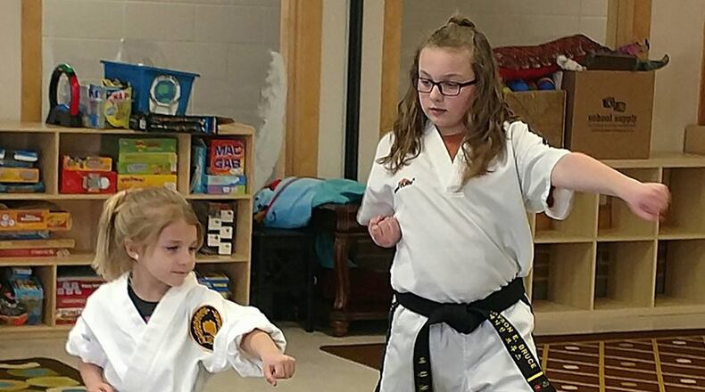 Madyson Bruce, right, teaches a taekwondo beginners class at the Youth Center, Wright-Patterson Air Force Base. (Courtesy photo)