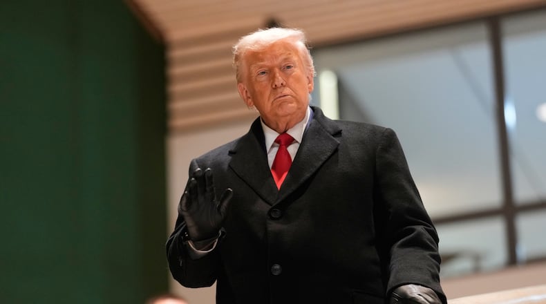 President Donald Trump walks down the stairs after a meeting during the Annual Meeting of the World Economic Forum in Davos, Switzerland, Wednesday, Jan. 21, 2026. (AP Photo/Markus Schreiber)