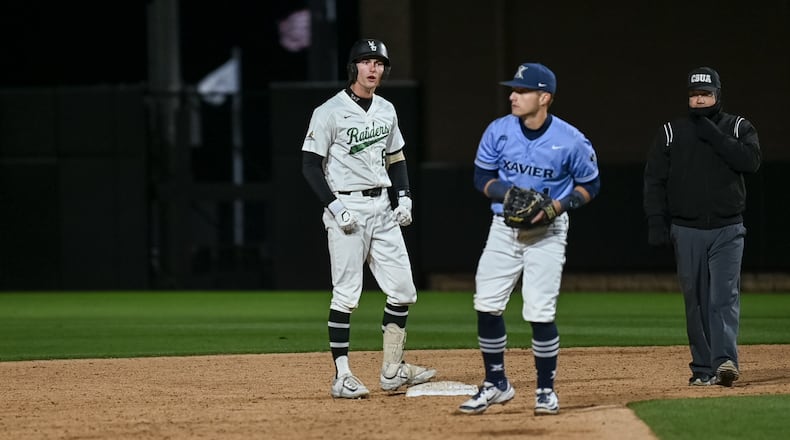 Wright State University sophomore and Chaminade Julienne grad JP Peltier celebrates at second base during their game earlier this season against Xavier University. Jordan Wommack / CONTRIBUTED PHOTO