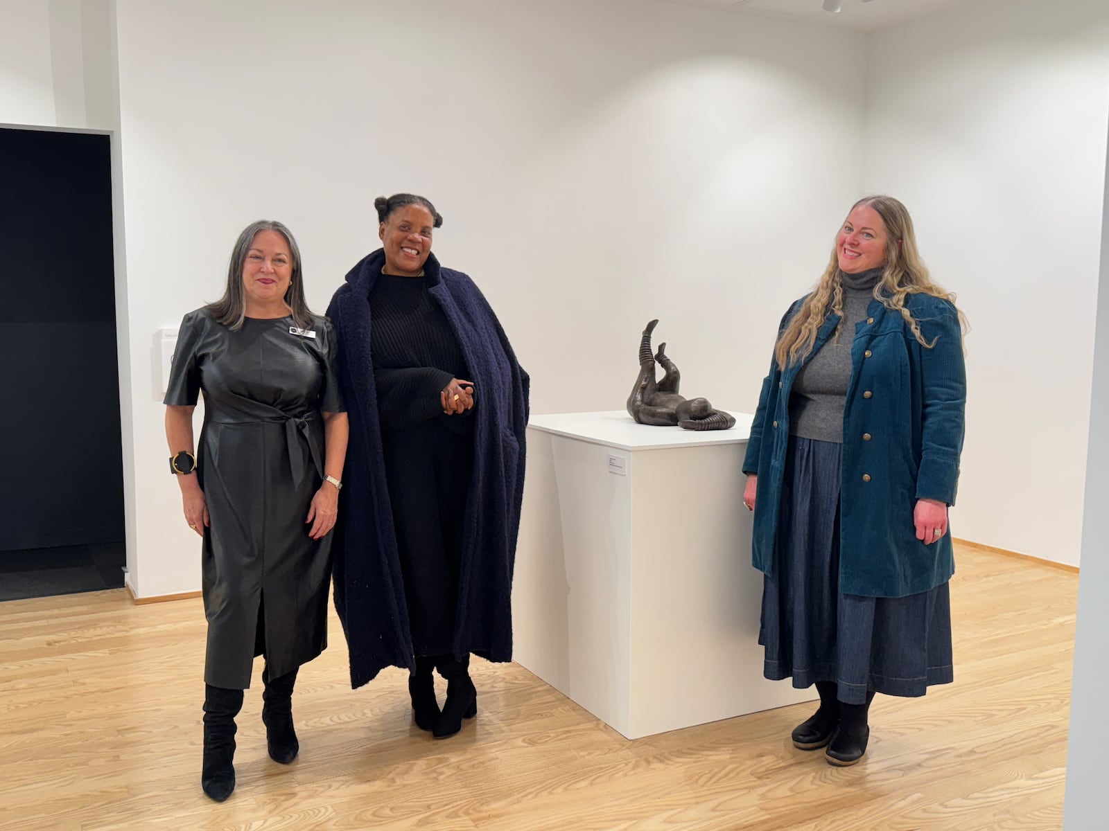 (L-R) Executive Director Eva Buttacavoli, artist Xaviera Simmons, Curator and Director of Programs and Engagement Heather Jones, with Simmons' artwork at The Contemporary Dayton. Simmons encouraged local artists to get to know the non-profit art center's staff and even its Board of Directors. CONTRIBUTED