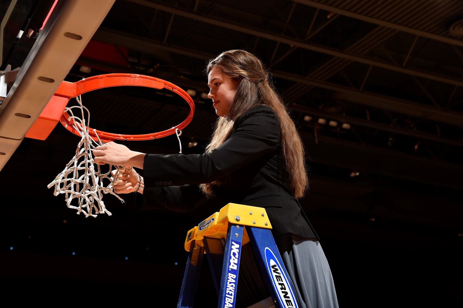 Julia Chandler cuts down the net after Dayton’s Atlantic 10 championship last year. CONTRIBUTED