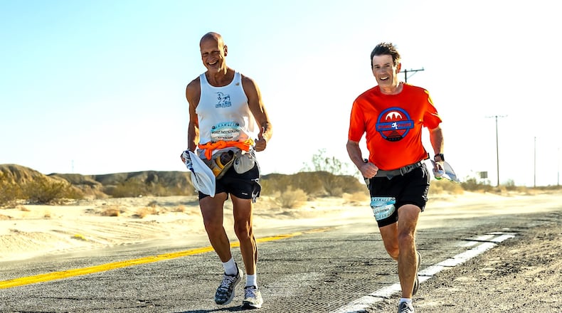 Dave Corfman and teammate Keith Straw running Badwater Salton Sea race, an 81-mile team race across the Anzo-Borrego Desert in California, last month. This weekend Corfman hopes to complete his 100th 100 mike race, the Mohican Trail 100. Straw already is in the 100x100 fraternity. CONTRIUBTED PHOTO