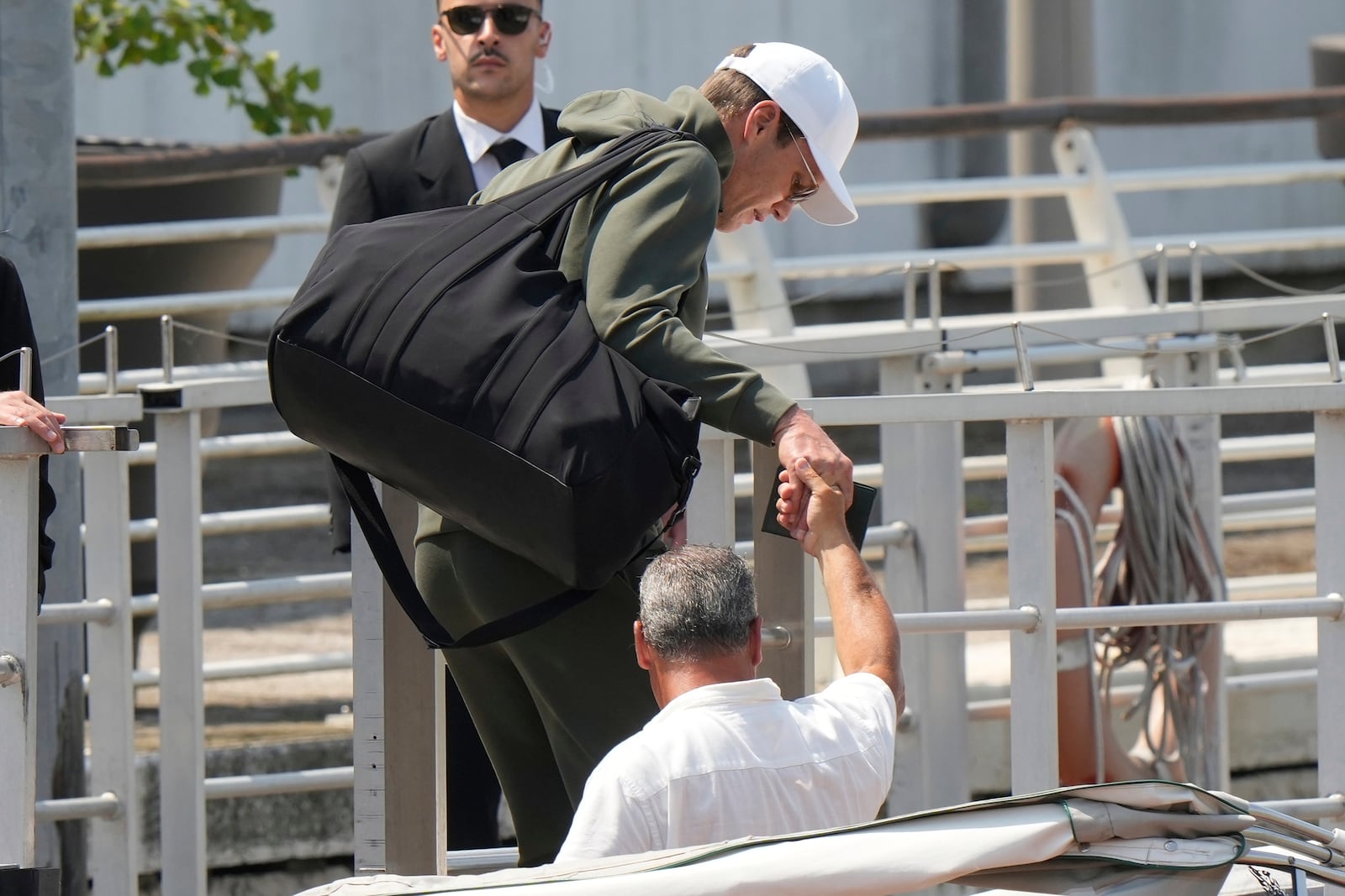Former NFL quarterback Tom Brady, center, arrives for the weekend wedding of Amazon founder Jeff Bezos and Lauren Sanchez, in Venice, Italy, Thursday, June 26, 2025. (AP Photo/Luca Bruno)