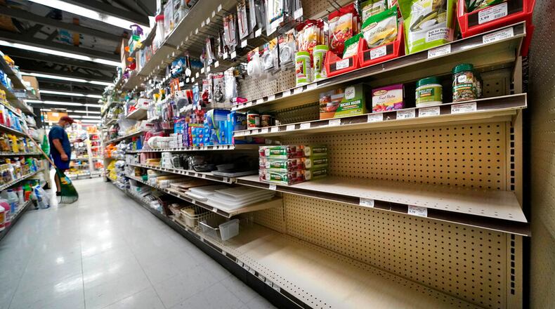 Shelves that are usually stocks with Mason jars and lids in the canning supply section are mostly empty at the Drillin True Value hardware store, Friday, Sept. 4, 2020, in South Portland, Maine. During this ongoing coronavirus pandemic many retailers have been frustrated by the scarce supply of jars and lids used for canning vegetables. (AP Photo/Robert F. Bukaty)