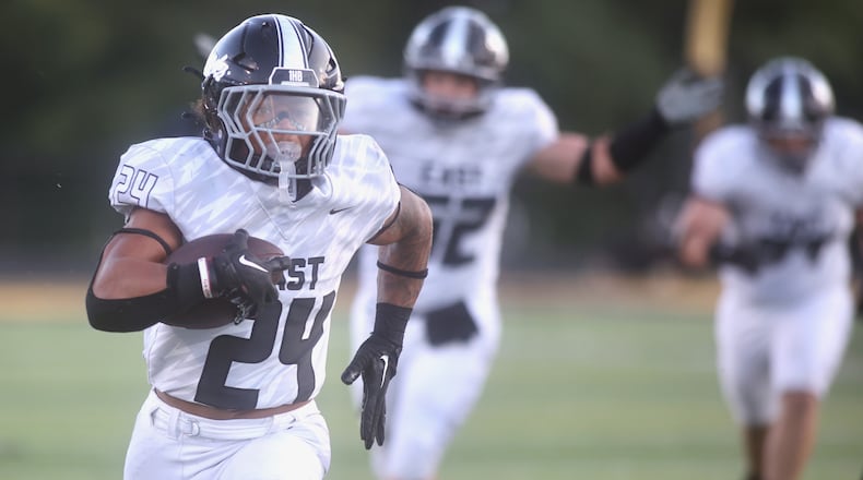 Lakota East’s Ryder Hooks runs for a touchdown against Centerville on Friday, Aug. 22, 2025, at Centerville Stadium. David Jablonski/Staff