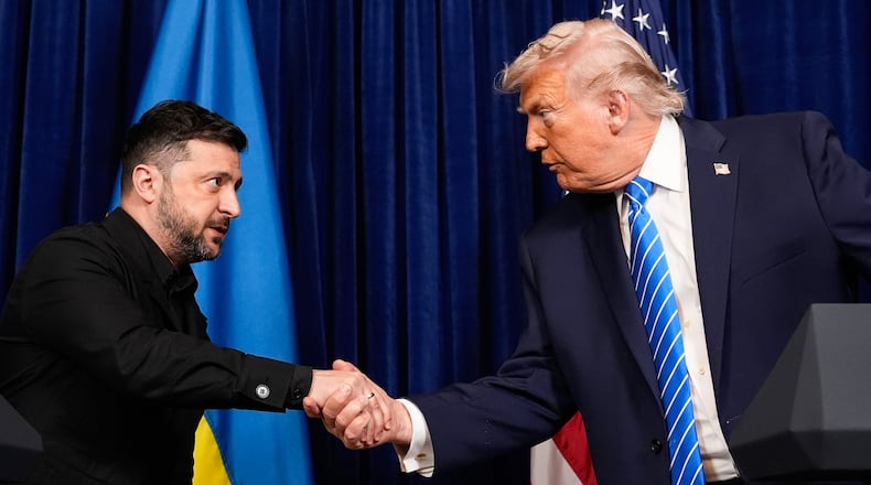 President Donald Trump and Ukraine's President Volodymyr Zelenskyy shake hands at the start of a joint news conference following a meeting at Trump's Mar-a-Lago club, Sunday, Dec. 28, 2025, in Palm Beach, Fla. (AP Photo/Alex Brandon)