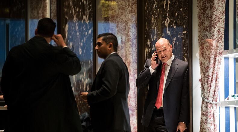 Gary Cohn, president and chief operating officer at Goldman Sachs, talks on his phone as he arrives at Trump Tower, November 29, 2016 in New York City. President-elect Donald Trump and his transition team are in the process of filling cabinet and other high level positions for the new administration.