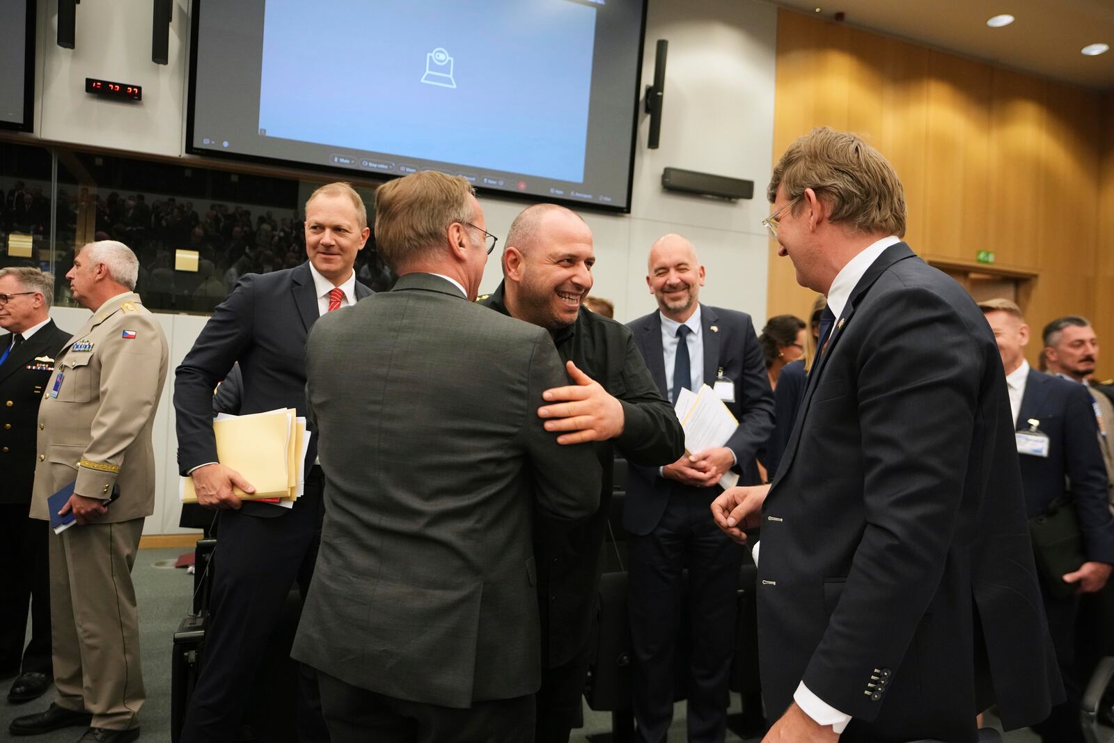 Ukraine's Defense Minister Rustem Umerov, center, is greeted by Germany's Defense Minister Boris Pistorius, center left, during a meeting of the Ukraine Defense Contact Group at the NATO headquarters in Brussels, Wednesday, June 4, 2025. (AP Photo/Virginia Mayo)