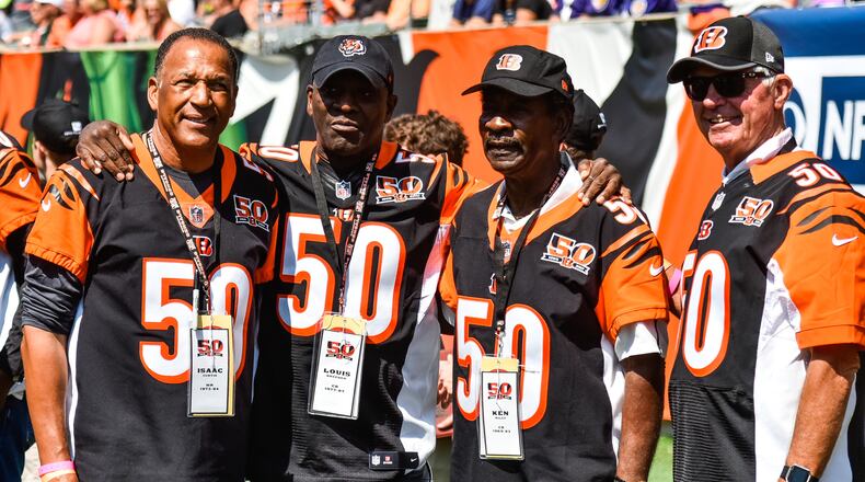 Former Bengals players (L to R) Isaac Curtis, Louis Breeden, Ken Riley and Ken Anderson gather before they are recognized at halftime. The Cincinnati Bengals lost 20-0 to the Baltimore Ravens Sunday, Sept. 10 at Paul Brown Stadium in Cincinnati. NICK GRAHAM/STAFF