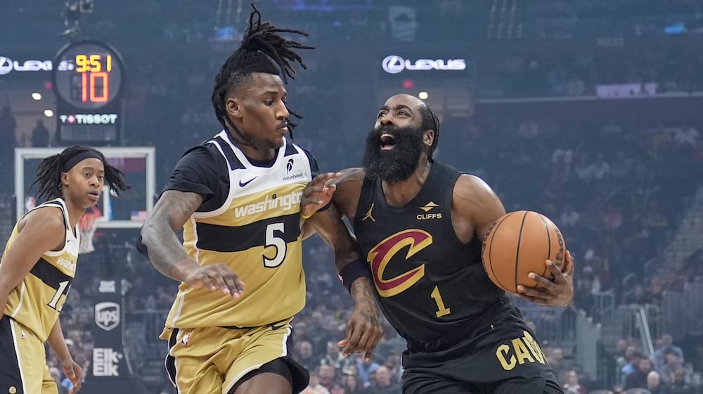 Cleveland Cavaliers guard James Harden (1) drives against Washington Wizards guard Jamir Watkins (5) in the first half of an NBA basketball game in Cleveland, Wednesday, Feb. 11, 2026. (AP Photo/Sue Ogrocki)