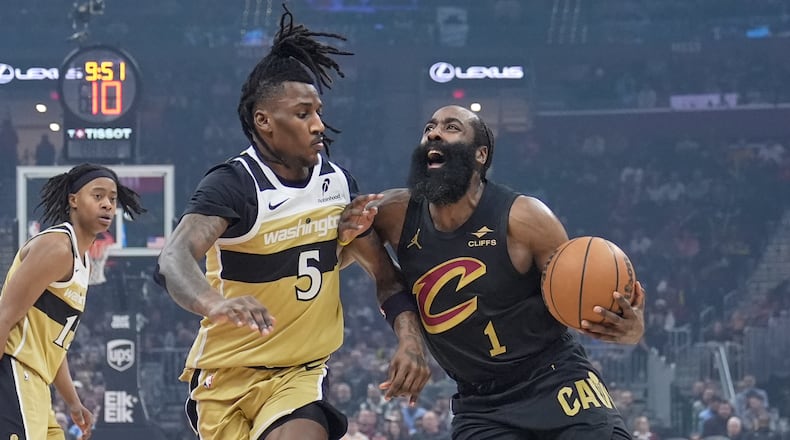 Cleveland Cavaliers guard James Harden (1) drives against Washington Wizards guard Jamir Watkins (5) in the first half of an NBA basketball game in Cleveland, Wednesday, Feb. 11, 2026. (AP Photo/Sue Ogrocki)
