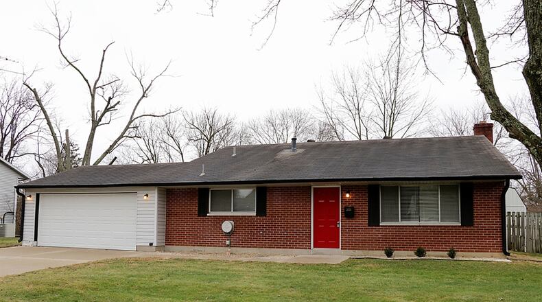 The tri-level offers about 1,710 sq. ft. of living space. The main level features a living room and eat-in kitchen with vaulted ceilings. The lower level has a recreation room with wood-burning fireplace and a full bathroom. Three bedrooms and a full bathroom are upstairs. CONTRIBUTED PHOTO BY KATHY TYLER