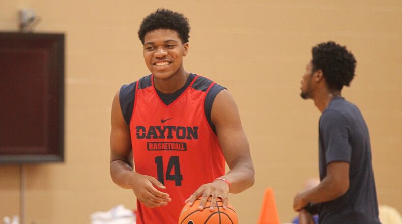 Dayton warming up for a practice at the Cronin Center in Dayton. David Jablonski/Staff