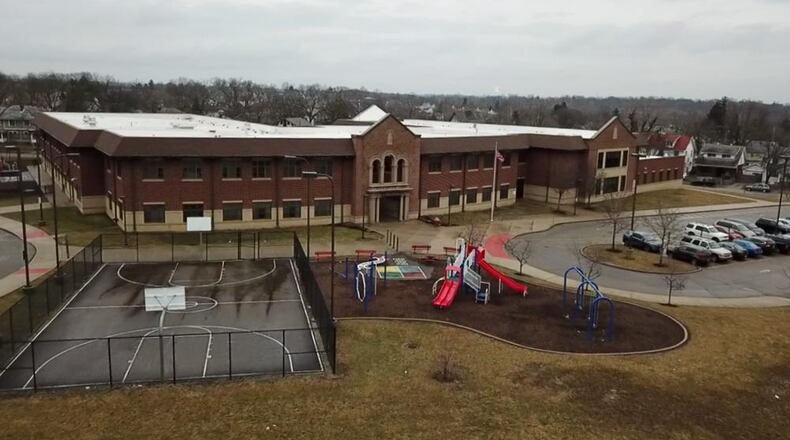 A 14-year-old was found with a gun at Edwin Joel Brown Middle School in Dayton on Wednesday, causing students to hit the floor. CHUCK HAMLIN / STAFF