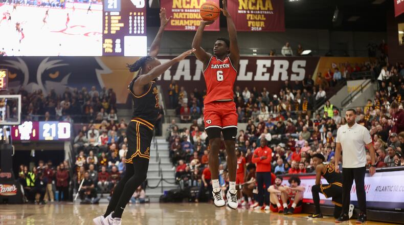Dayton's Enoch Cheeks makes a 3-pointer in the first half against Loyola Chicago on Friday, Feb. 21, 2025, at Gentile Arena in Chicago. David Jablonski/Staff