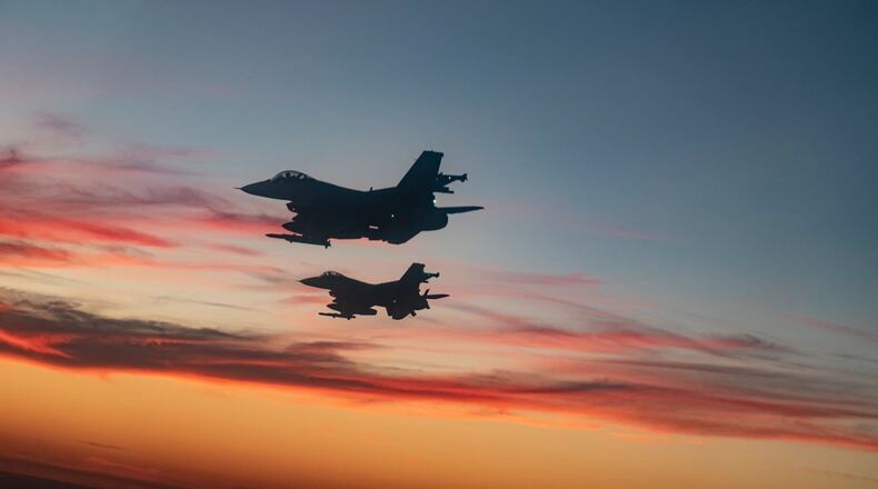F-16 Fighting Falcons from Eglin Air Force Base fly over a high school football game in Niceville, Fla., Sept. 24, 2021.  (U.S. Air Force photo by Master Sgt. Tristan McIntire)