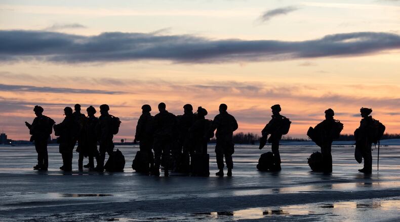 U.S. Air Force tactical air control party (TACP) specialists from Detachment 1, 3rd Air Support Operations Squadron, and combat weather Airmen assigned to Detachment 3, 1st Combat Weather Squadron, wait to board an Alaska Air National Guard C-17 Globemaster III while conducting airborne operations at Joint Base Elmendorf-Richardson, Alaska, Feb. 22, 2022. Members of the Alaska Air National Guard’s 176th Wing provided air support for the training. The Air Force special warfare Airmen conducted the training to demonstrate airborne and mission-readiness skills in Arctic conditions. (U.S. Air Force photo by Alejandro Peña)