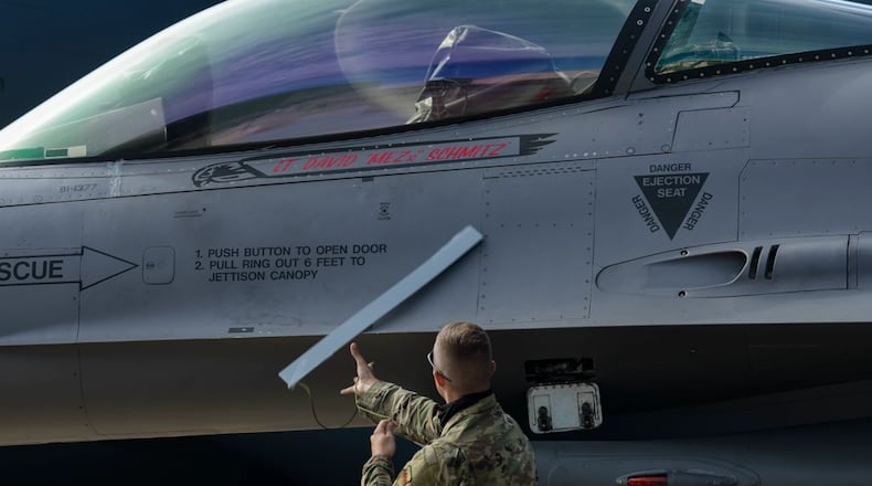 An U.S Air Force Airman assigned to the 77th Fighter Generation Squadron reveals the name of late 1st Lt. David Schmitz during a celebration of life at Shaw Air Force Base, South Carolina, July 10, 2020. Friends, family and Airmen gathered in memoriam and took turns to speak about the fellow Airman and person Schmitz was. (U.S. Air Force photo by Airman 1st Class Destani K. Matheny)