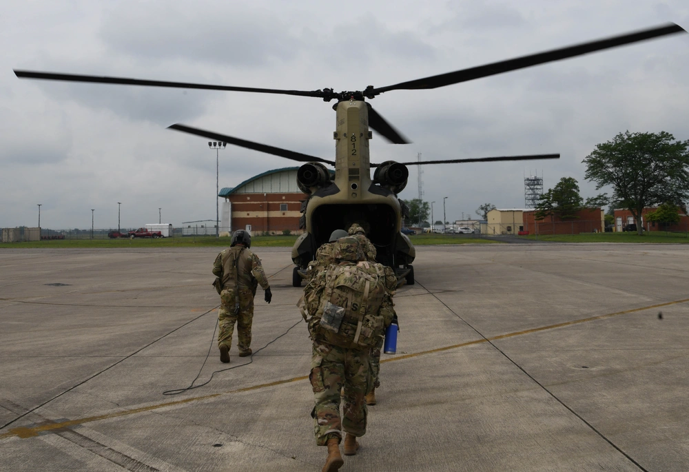 Airmen assigned to the 178th Wing board an Ohio National Guard CH-47 Chinook helicopter assigned to Company B, 3rd Battalion, 238th Aviation Regiment during a combat readiness inspection at Springfield-Beckley Air National Guard Base, Ohio, July 14, 2025. CONTRIBUTED