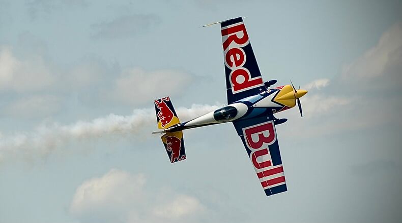 Kevin Coleman flies his Red Bull act in the Dayton Air Show on Saturday, July 30, 2022. MARSHALL GORBY/STAFF