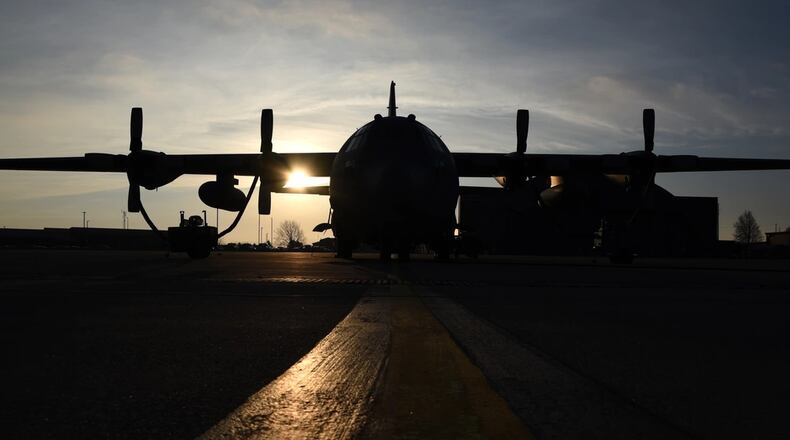 The sun rises over the flightline at the 179th Airlift Wing, Mansfield, Ohio, casting its morning glow on the C-130H Hercules on Dec. 28, 2016.  (U.S. Air National Guard photo by Airman Megan Shepherd/Released)