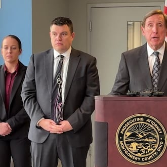 Montgomery County Prosecutor Mat Heck Jr., at podium, announces a 91-count indictment against Oakwood attorney Matthew Currie, who is accused of stalking and secretly recording a teen girl and other women in the neighborhood. At left is Oakwood detective Kasey Ballinger, Bryan Moore, chief of the juvenile division of the prosecutor's office and Alan Hill, chief of the Oakwood Public Safety Department. JEN BALDUF/STAFF
