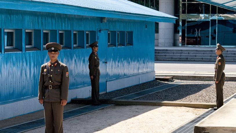Korean People's Army soldiers stand guard at the MDL, which is the border between the two Koreas.