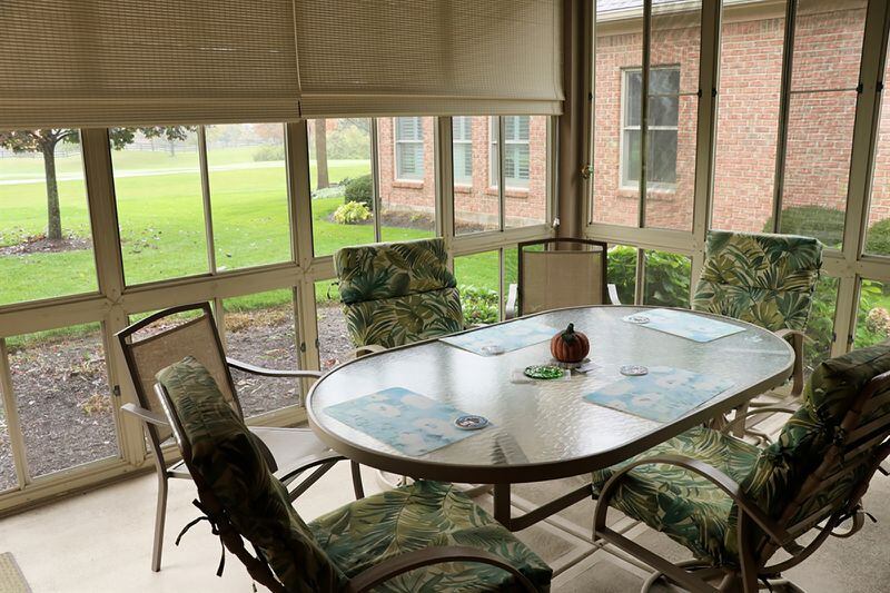 From the screened-in porch, a door opens to the sun terrace and the backyard.  ACCOMPANYING PHOTOGRAPH BY KATHY TYLER
