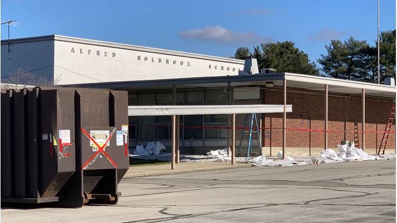 Abatement crews are working to prepare the former Holbrook Elementary School for demolition which could start sometime in February. The building on Holbrook Avenue formerly served as a junior high school, an elementary school and the district's central offices. ED RICHTER/STAFF