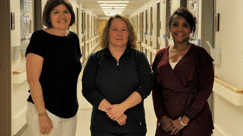 Left to right: Jennifer Grove, Wendy Croft and Jane Esprit were all diagnosed and treated for breast cancer and had breast reconstruction at Wright-Patterson Air Force Base’s Medical Center using their own tissues. The medical center’s plastic surgery clinic provides patients the full spectrum of reconstruction, from implants to tissue-based options, so that women have the opportunity to decide which options are best for them. (U.S. Air Force photo/Karina Brady)